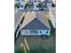 Aerial view of home featuring a backyard with lush green grass and a covered patio at 345 Mangrove Manor Dr, Apollo Beach, FL 33572