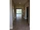 Inviting hallway with tile flooring leading to a living area with water views at 345 Mangrove Manor Dr, Apollo Beach, FL 33572