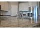 Granite kitchen countertop with stainless steel sink and faucet with stainless appliances in background at 345 Mangrove Manor Dr, Apollo Beach, FL 33572