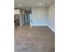 Spacious open concept living area with tile floors and modern stainless appliances at 345 Mangrove Manor Dr, Apollo Beach, FL 33572