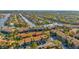 Aerial view of the waterfront condo community featuring canals, lush greenery, and parking at 6320 Newtown Cir # 20B1, Tampa, FL 33615