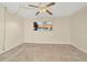 Spacious bedroom with neutral walls, soft carpet, and a window at 6320 Newtown Cir # 20B1, Tampa, FL 33615