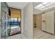 Welcoming entryway and kitchen features white tile flooring, neutral walls, and a modern appliance at 6320 Newtown Cir # 20B1, Tampa, FL 33615