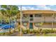 Attractive two-story condo with a well-maintained exterior and verdant landscaping at 6320 Newtown Cir # 20B1, Tampa, FL 33615
