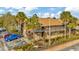 Exterior view of a multi-story building with landscaped grounds and ample parking at 6320 Newtown Cir # 20B1, Tampa, FL 33615