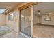 Cozy living room with neutral carpet and adjacent outdoor patio through sliding glass doors at 6320 Newtown Cir # 20B1, Tampa, FL 33615