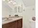 Bathroom with a single sink vanity, a large mirror, and modern lighting fixtures at 11419 Donneymoor Dr, Riverview, FL 33569