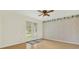 Bright bedroom featuring french doors to the yard and ceiling fan at 11419 Donneymoor Dr, Riverview, FL 33569