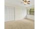 Neutral bedroom featuring bright light from window and closet space at 11419 Donneymoor Dr, Riverview, FL 33569