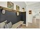 Inviting entryway with a bench, decorative wall art, and access to the main living areas at 11419 Donneymoor Dr, Riverview, FL 33569