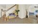 Open-concept foyer with a charming bench, stylish decor, and bedroom view at 11419 Donneymoor Dr, Riverview, FL 33569