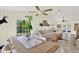 Spacious living room with lots of natural light, fan, and stylish furnishings at 11419 Donneymoor Dr, Riverview, FL 33569