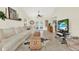 Bright living room featuring tile flooring, vaulted ceilings and neutral decor throughout at 11419 Donneymoor Dr, Riverview, FL 33569