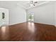 Spacious bedroom features hardwood floors, large windows, and a ceiling fan at 3328 Circleville St, North Port, FL 34286