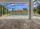 Beautiful backyard pool area, screened-in for year-round enjoyment at 3328 Circleville St, North Port, FL 34286