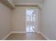 Entry to the living room or possible dining room from a hallway at 3107 Clifford Sample Dr, Tampa, FL 33619