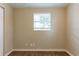 Neutral bedroom with a window letting in ample light and modern vinyl flooring at 7216 E Emma St, Tampa, FL 33610