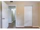 An open bedroom doorway leads to a hall; also features a closet with folding doors at 7216 E Emma St, Tampa, FL 33610