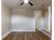 Clean bedroom with a ceiling fan, modern floors, and light walls at 7216 E Emma St, Tampa, FL 33610
