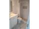 Modern bathroom with a walk-in shower, stylish vanity, and sleek marble flooring at 18686 Van Nuys Cir, Port Charlotte, FL 33948