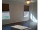Bright bedroom with hardwood floors, dual windows, and a closet at 18686 Van Nuys Cir, Port Charlotte, FL 33948