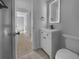 Updated bathroom featuring a modern vanity, stylish tile flooring, and contemporary mirror at 913 27Th E St, Bradenton, FL 34208