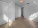 Bedroom with a chandelier, tile floors, large closet, and neutral walls at 913 27Th E St, Bradenton, FL 34208