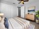 Cozy bedroom with ceiling fan, dresser, and ample closet space at 913 27Th E St, Bradenton, FL 34208
