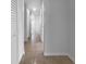 Bright hallway with tile flooring and ample closet space, connecting various rooms in the home at 913 27Th E St, Bradenton, FL 34208