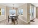 Dining room with a modern table set and a view of the marina at 606 Riviera Dunes Way # 604, Palmetto, FL 34221