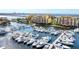 An aerial view featuring the condos and marina along the waterfront, lined with a vast number of boats at 606 Riviera Dunes Way # 604, Palmetto, FL 34221