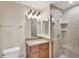 This is a bathroom with a glass shower, granite top vanity and an oversized sink at 606 Riviera Dunes Way # 604, Palmetto, FL 34221