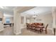 Formal dining room with a large wooden table and chairs, perfect for entertaining or Gathering meals at 606 Riviera Dunes Way # 604, Palmetto, FL 34221
