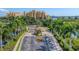 Aerial view of the property entrance featuring manicured landscaping and a grand building complex at 606 Riviera Dunes Way # 604, Palmetto, FL 34221