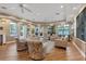 Cozy lounge area featuring comfortable seating, warm lighting, and stylish decor for relaxation at 606 Riviera Dunes Way # 604, Palmetto, FL 34221
