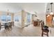 Open-concept living space featuring a dining area, kitchen, and an office space with marina views at 606 Riviera Dunes Way # 604, Palmetto, FL 34221