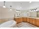 Bathroom boasting dual sinks, soaking tub, and attractive fixtures at 606 Riviera Dunes Way # 604, Palmetto, FL 34221