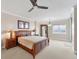 Spacious bedroom with a large bed and waterfront views at 606 Riviera Dunes Way # 604, Palmetto, FL 34221