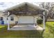 Attached two-car carport with covered parking on a sunny day at 3319 Powerline Rd, Lithia, FL 33547