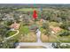 Aerial view of the home highlighting the surrounding landscape and neighborhood, under a canopy of mature trees at 6604 Stafford Terrace Ave, Plant City, FL 33565