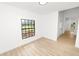 Bedroom featuring luxury vinyl plank flooring and a large window at 6604 Stafford Terrace Ave, Plant City, FL 33565