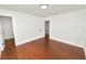 Bedroom featuring hardwood floors, recessed lighting, and a doorway to the staircase at 6604 Stafford Terrace Ave, Plant City, FL 33565