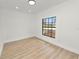 An empty bedroom featuring natural light, recessed lights and hardwood floors at 6604 Stafford Terrace Ave, Plant City, FL 33565