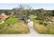 Beautiful two-story home with a long driveway, attached garage, covered porch, mature trees and landscaping at 6604 Stafford Terrace Ave, Plant City, FL 33565