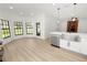 Modern kitchen featuring stainless steel appliances, light wood floors and lots of natural light at 6604 Stafford Terrace Ave, Plant City, FL 33565