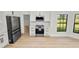 Contemporary kitchen design with stainless steel appliances, sleek cabinets, and a bright window at 6604 Stafford Terrace Ave, Plant City, FL 33565