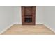 Open living room featuring luxury flooring, fireplace with brick surround at 6604 Stafford Terrace Ave, Plant City, FL 33565