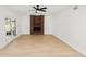 Open living room featuring luxury flooring, fireplace and bright natural light at 6604 Stafford Terrace Ave, Plant City, FL 33565