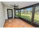 Spacious screened porch with tile floor provides access to backyard at 6604 Stafford Terrace Ave, Plant City, FL 33565