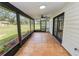 Spacious screened porch with tile floor provides access to backyard and side yard at 6604 Stafford Terrace Ave, Plant City, FL 33565